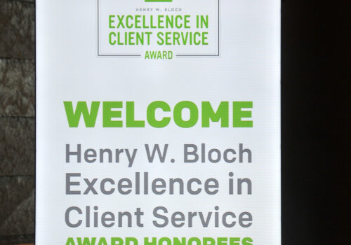 sign to welcome winners of the 2018 Henry W. Bloch Excellence in Client Service Award